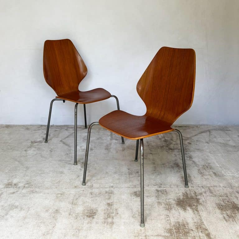 Pair of 1950s Danish teak plywood chairs by Herbert Hirche for Jofa Stålmøbler, with sculptural moulded seats and original tubular steel frames.