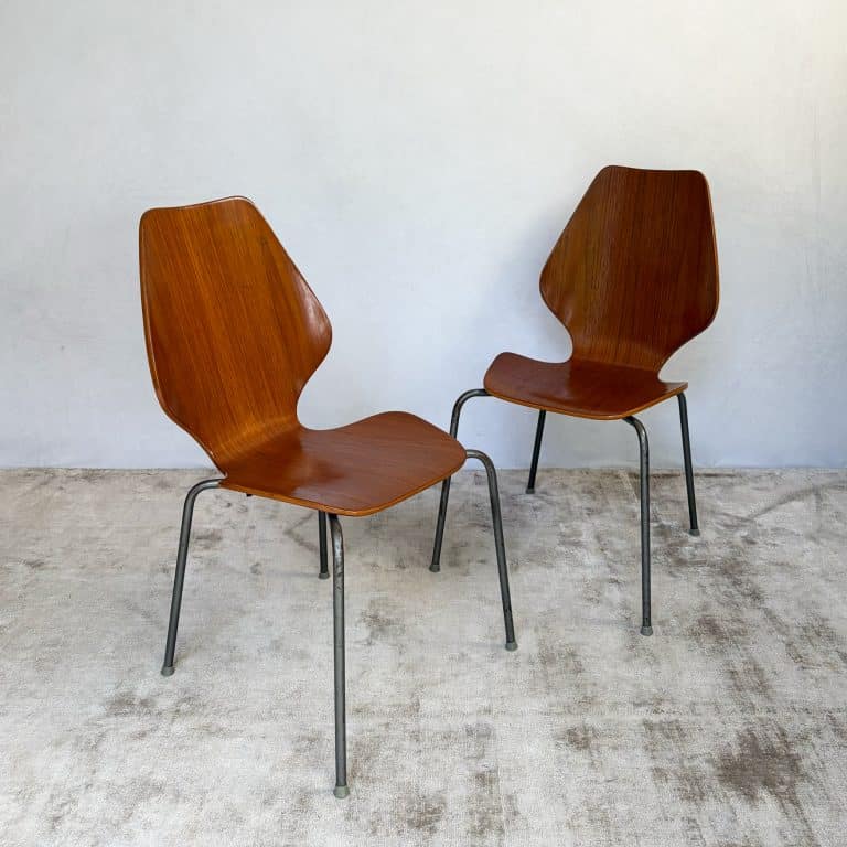 Pair of 1950s Danish teak plywood chairs by Herbert Hirche for Jofa Stålmøbler, with sculptural moulded seats and original tubular steel frames.