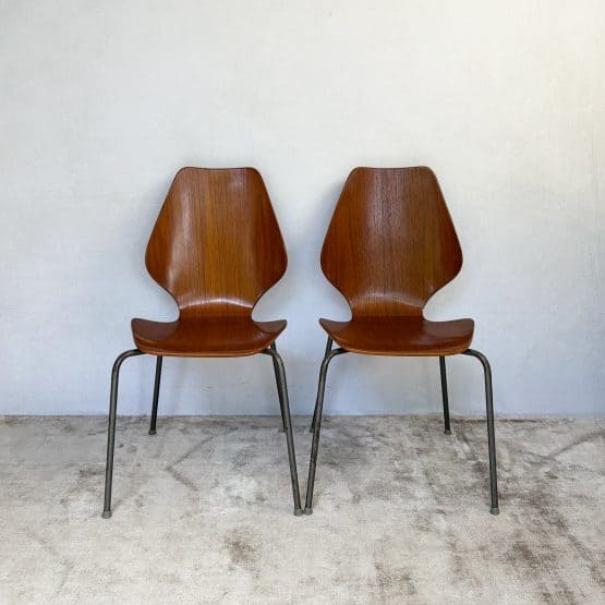 Pair of 1950s Danish teak plywood chairs by Herbert Hirche for Jofa Stålmøbler, with sculptural moulded seats and original tubular steel frames.