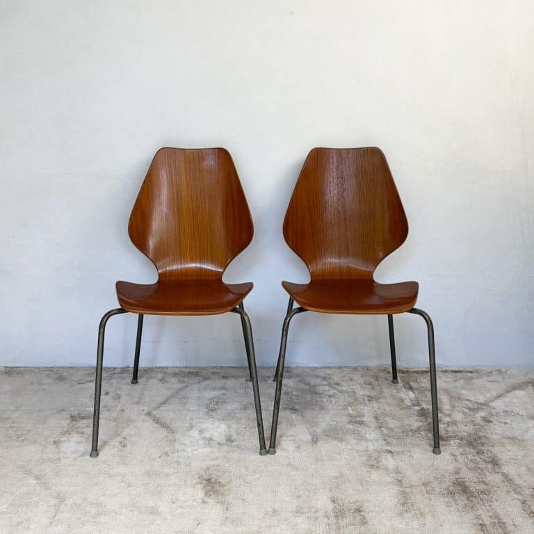 Pair of 1950s Danish teak plywood chairs by Herbert Hirche for Jofa Stålmøbler, with sculptural moulded seats and original tubular steel frames.