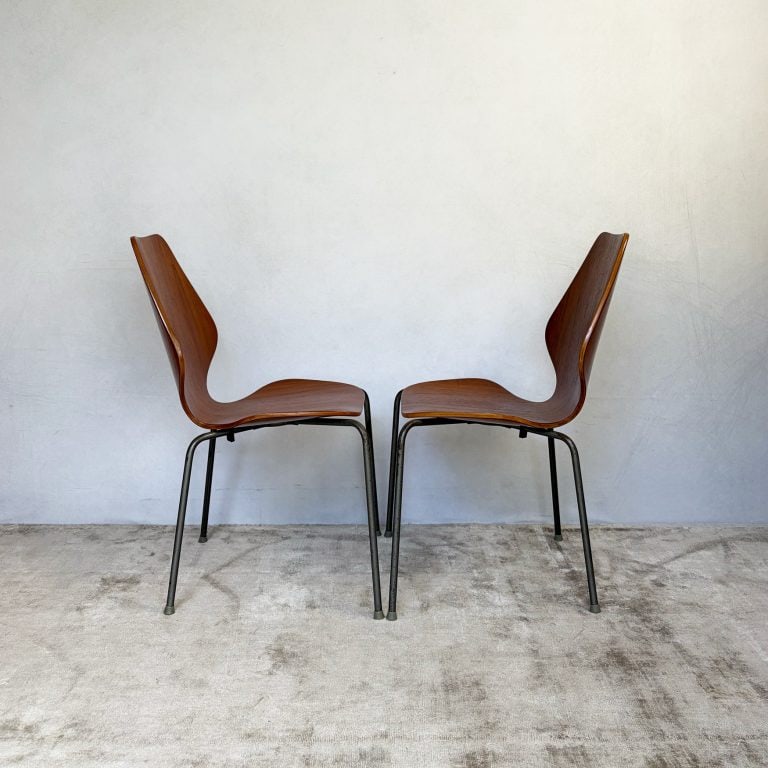 Pair of 1950s Danish teak plywood chairs by Herbert Hirche for Jofa Stålmøbler, with sculptural moulded seats and original tubular steel frames.