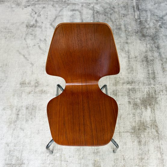 Pair of 1950s Danish teak plywood chairs by Herbert Hirche for Jofa Stålmøbler, with sculptural moulded seats and original tubular steel frames.