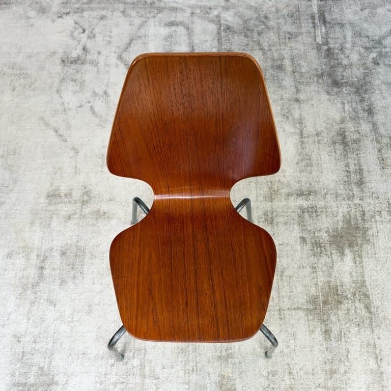 Pair of 1950s Danish teak plywood chairs by Herbert Hirche for Jofa Stålmøbler, with sculptural moulded seats and original tubular steel frames.