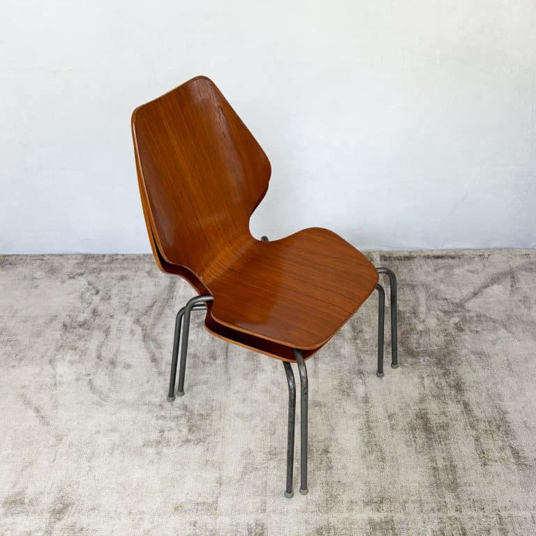 Pair of 1950s Danish teak plywood chairs by Herbert Hirche for Jofa Stålmøbler, with sculptural moulded seats and original tubular steel frames.