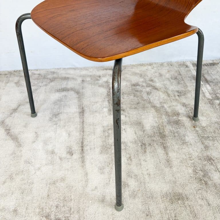 Pair of 1950s Danish teak plywood chairs by Herbert Hirche for Jofa Stålmøbler, with sculptural moulded seats and original tubular steel frames.